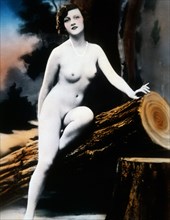 Nude Woman Seated on Log, Hand Colored Photograph