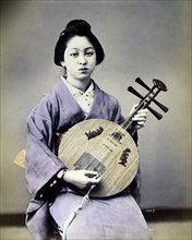Japanese Woman Musician, Hand-Colored Albumen Photograph, circa 1879