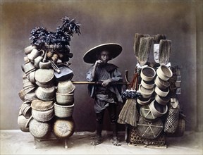 Japanese Man Selling Baskets, Hand-Colored Albumen Photograph, circa 1870