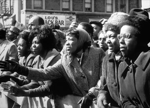Distraught African-American Women Waving Farewell to Slain Leader, Malcolm X, at Faith Temple, New York City, USA, February 27 1965