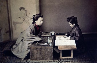 Japanese Mother Teaching Child Calligraphy, circa 1890