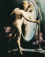 Standing Nude Woman Looking into Full Length Mirror, Hand colored Photograph, circa 1927