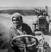 Woman Driving Tractor on Collective Farm, Soviet Union, 1928
