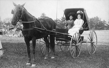 Two Women in a Horse-Drawn Buggy, 1910