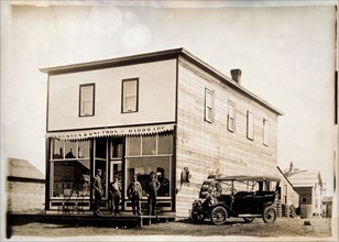 Four Men in Front of Hardware Store, Portrait, circa 1915