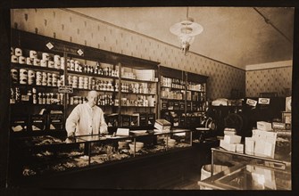 Man Standing Behind Counter in Grocery Store, Chicago, Illinois, USA, 1914