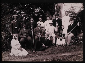Group of Zulu Men and Women in Western Clothes With a British Gentleman, South Africa, circa 1890