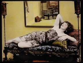 Sexy Woman Laying on Sofa Draped in Sheer Floral Fabric, Portrait, Hand-Colored Photograph, 1927