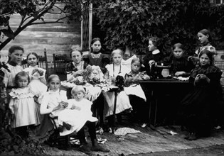 Group of Women and Children With Sewing Machine, Portrait, circa 1900