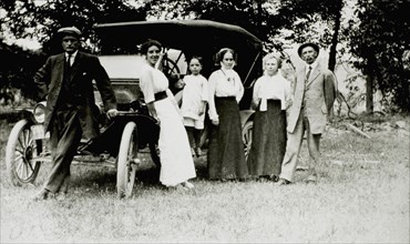 Adults and Child Standing Next to Ford Model T, 1913