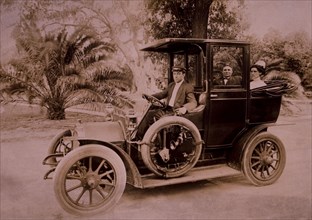 Couple and Driver in Automobile, USA, circa 1908