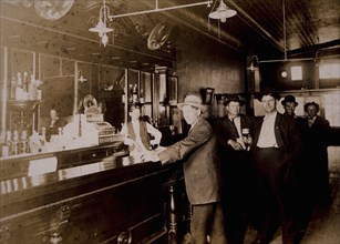 Men Drinking in Bar, USA, circa 1910