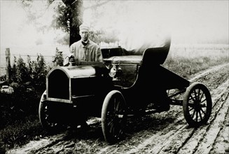Man Standing Near Automobile on Dirt Road, USA, 1908