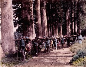 Japanese Men Carrying Japanese Women in Traveling Chairs Along Rural Road, Kusakabe Kimbei, Hand-Colored Photograph, circa 1870