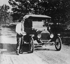Man Standing Next to Ford Model T Car, circa 1918