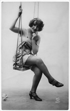 French Lingerie Model Seated on Swing, circa 1920