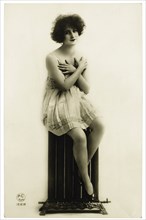 French Lingerie Model Posing with Hands Covering Breasts, circa 1920