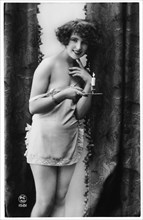 French Lingerie Model Smiling and Holding Candle, 1920
