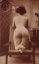 Nude Woman Kneeling on Chair, Rear View, circa 1910's