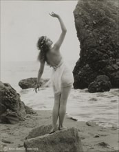 Actress Harriet Hammond, One of Mack Sennett's Bathing Beauties, Portrait in Bathing Suit at Beach, Rear View, circa 1920