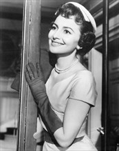 Olivia de Havilland on-set of the Film, The Ambassador's Daughter, 1956