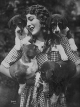 Mary Pickford with Four Puppies, circa 1910's