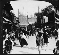 Busy Street Scene with Mosque in Background, Delphi, India, Single Image of Stereo Card, 1907
