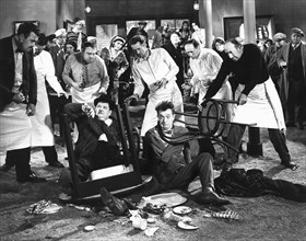 Oliver Hardy, Stan Laurel, Constantine Romanoff and Tiny Sandford on-set of the Film, Below Zero, 1930