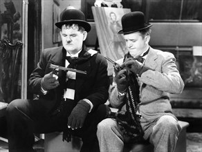Oliver Hardy and Stan Laurel on-set of the Film, The Fixer-Uppers, 1935