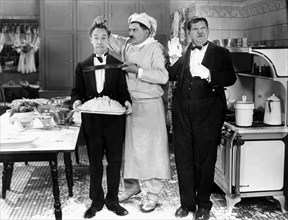 Stan Laurel, Oliver Hardy and Otto Fries on-set of the Film, From Soup to Nuts, 1928