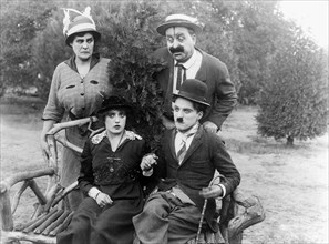 Charlie Chaplin, Phyllis Allen, Mabel Normand and Mack Swain on-set of the Film, Getting Acquainted, 1914