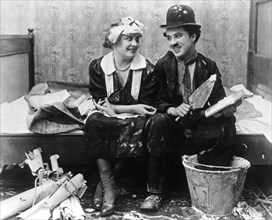 Edna Purviance and Charlie Chaplin on-set of the Film, Work, 1915