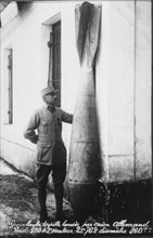 French World War I Postcard, Man Standing Next to Large Torpedo, Grosse Bombe Torpille Lanceé par Avion, circa 1914