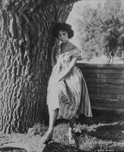 Rita Moreno Standing Against Tree, Portrait, circa 1950's