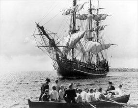 Trevor Howard and Crew Adrift in Longboat with HMS Bounty in Background, on-set of the Film, "Mutiny on the Bounty" directed by Lewis Milestone, 1962