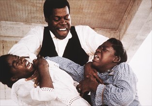Whoopi Goldberg, Danny Glover and Akosua Busia, on-set of the Film, "The Color Purple", 1985