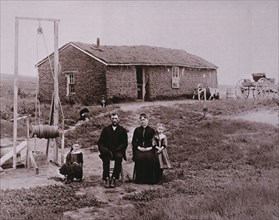 Pioneer Family in Front of Sod House, Portrait, Kansas, USA, circa 1880