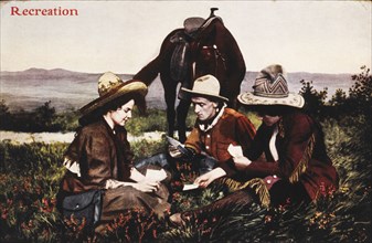 Two Cowboys and a Woman Playing Cards During a Rest on the Trail, West, USA, circa 1909