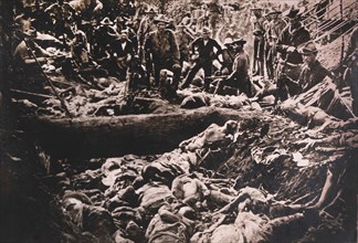 American Soldiers View Bodies of Dead Philippine Insurgents, Philippines, circa 1900