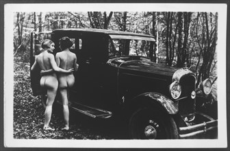 Two Nude Women Standing Near Car, Rear View, 1925