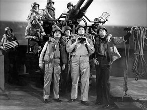 Edward G. Robinson, (left), Glenn Ford, (right), on-set of the Film, "Destroyer", 1943