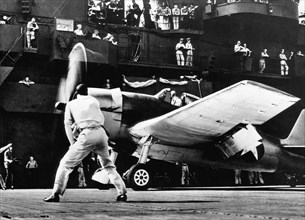 Soldiers and Airplane on Deck of the USS Yorktown, on-set of the Documentary Film, "The Fighting Lady", 1944