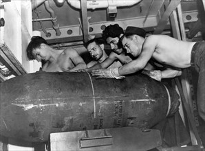 Soldiers with Bomb Aboard the USS Yorktown, on-set of Documentary Film, The Fighting Lady, 1944