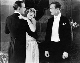 Robert Ellis, Claire Windsor, John Patrick, on-set of the Silent Film, " For Sale", 1924