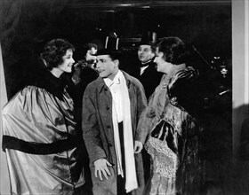 Constance Talmadge, (left), Harrison Ford, on-set of the Silent Film, "Good Night, Paul", 1918