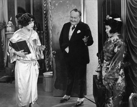 Gloria Swanson, (left), Walter Hiers, on-set of the Silent Film, "Her Gilded Cage", 1922