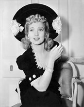 Ann Sothern, Wearing Bracelet Given to her by Red Skelton, on-set of the Film, "Maisie Gets her Man", 1942