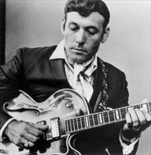 Carl Perkins Playing Guitar, circa Late 1960's