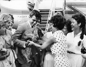 Fabian with his Dog, Sam, Being Greeted by Fans at Airport, New York City, USA, 1959