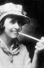 Mistinguett, French Actress and Singer, Smoking a Pipe, circa 1910's